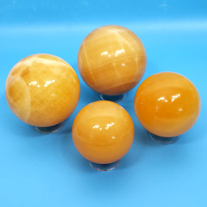 Orange Calcite Spheres – Radiant Bursts of Creative Energy