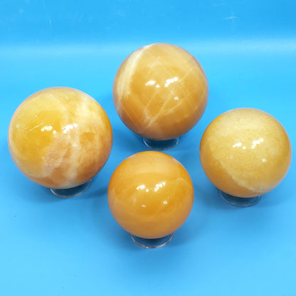 Orange Calcite Spheres – Radiant Bursts of Creative Energy