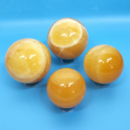 Orange Calcite Spheres – Radiant Bursts of Creative Energy